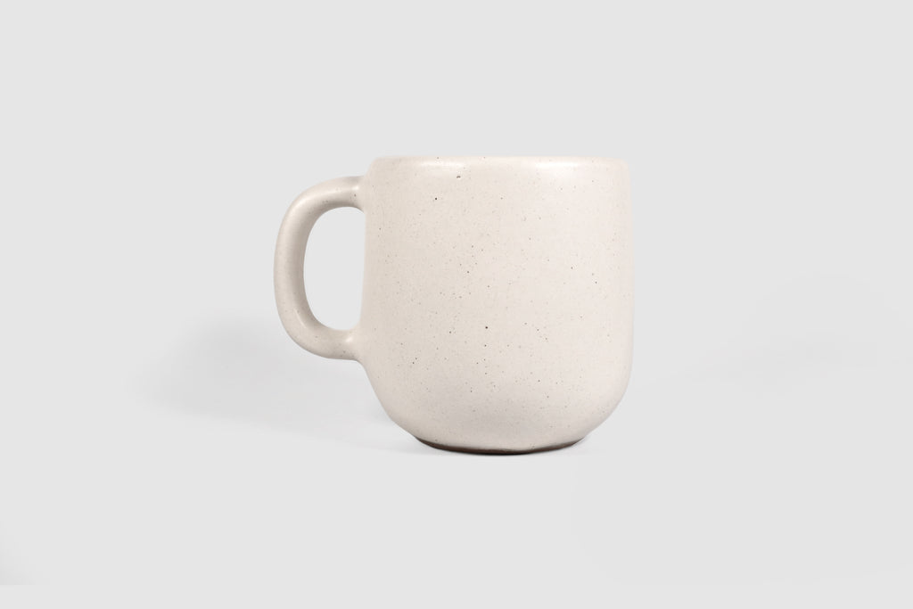 Cappuccino mug with swelling body and pulled handle in Chocolate glaze