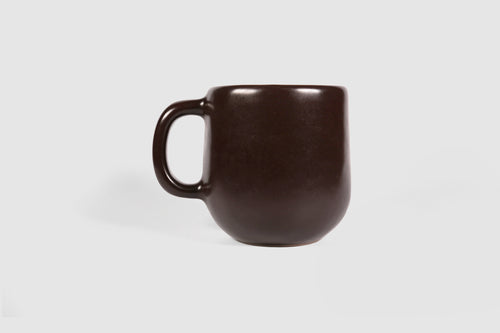 Cappuccino mug with swelling body and pulled handle in Chocolate glaze