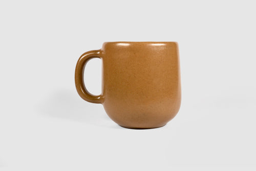 Cappuccino mug with swelling body and pulled handle in Chocolate glaze