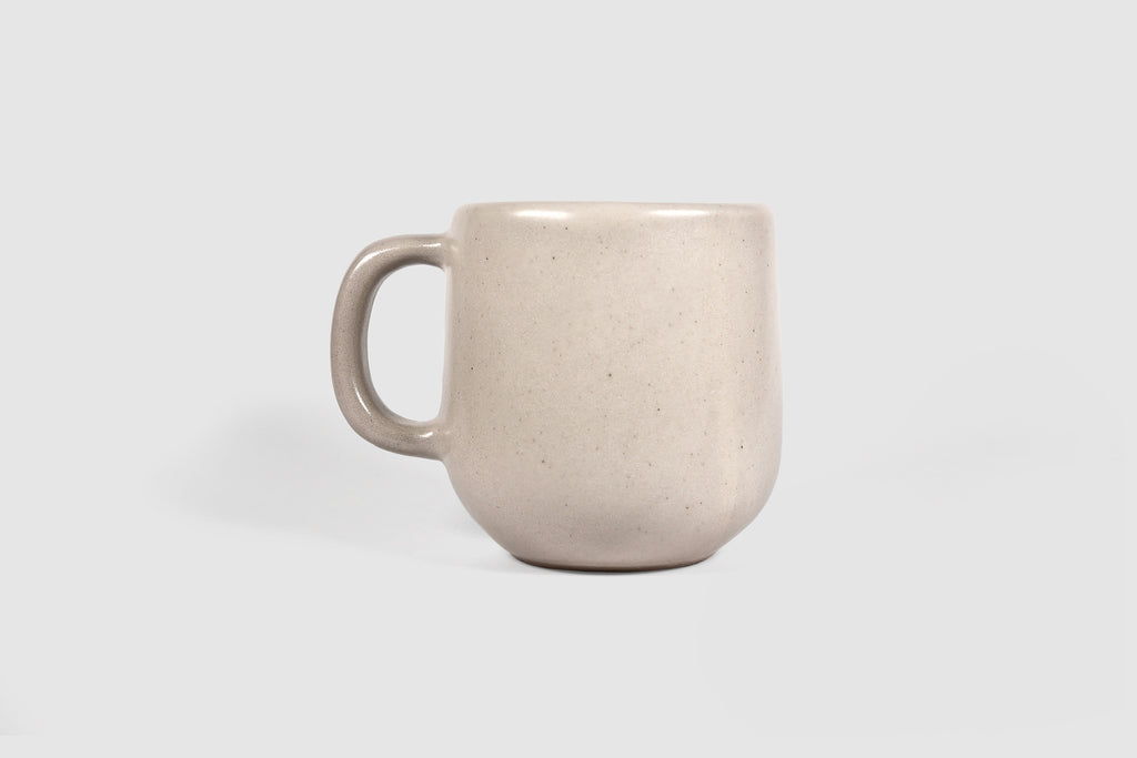 Cappuccino mug with swelling body and pulled handle in Chocolate glaze