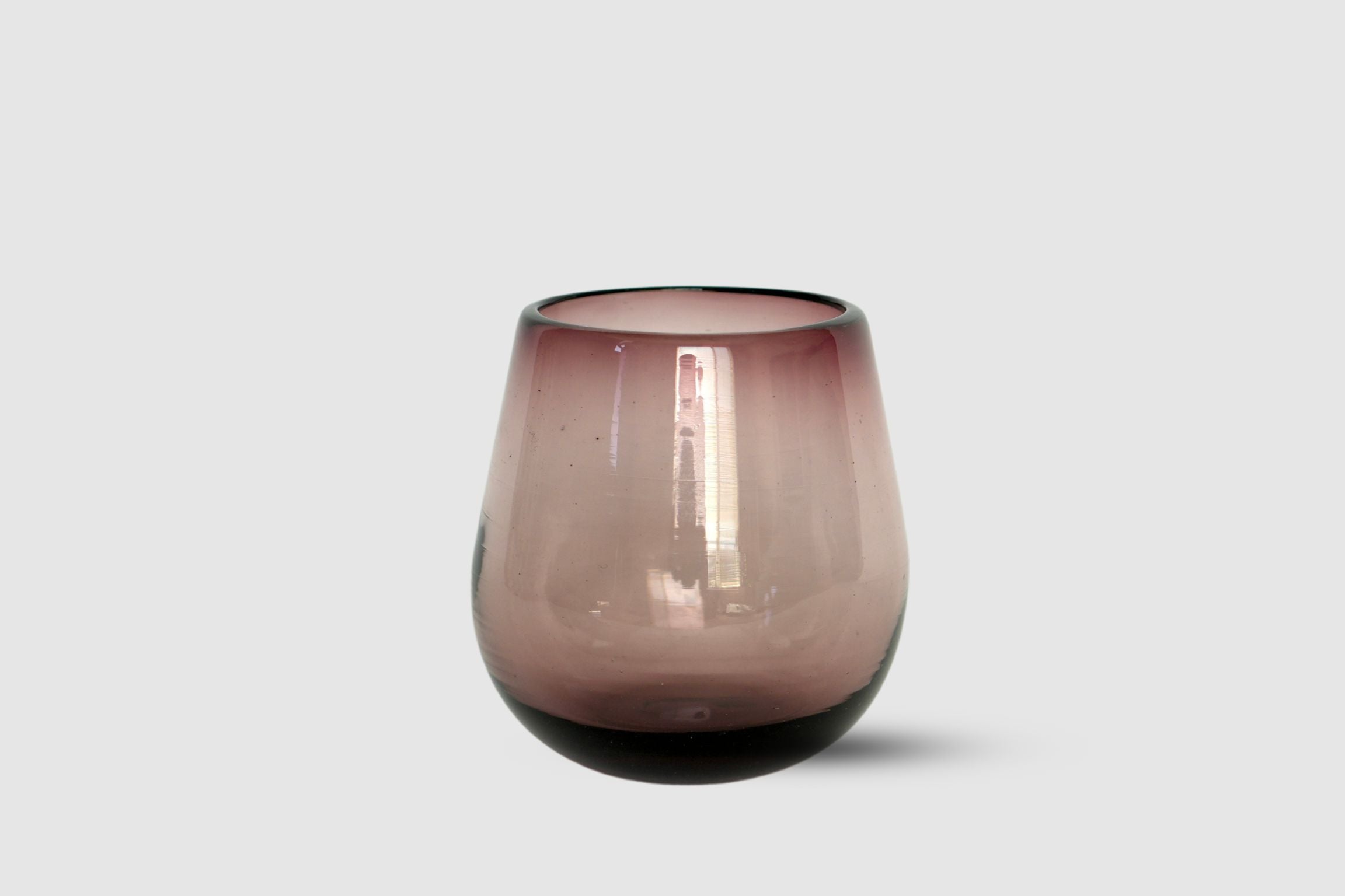 Amethyst drop-shaped hand-blown tumbler in jewel-toned violet on white