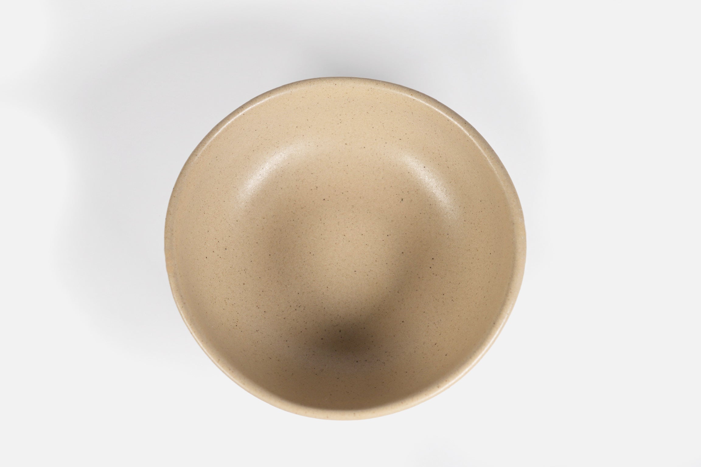 Bowl Sanka by Humo 1810 – black semi-matte stoneware, unglazed exterior, soft triangular form, 6.25 inch