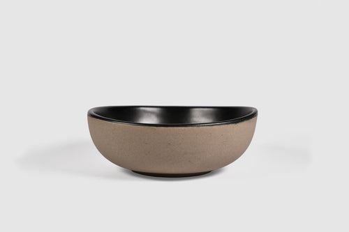 Bowl Sanka by Humo 1810 – black semi-matte stoneware, unglazed exterior, soft triangular form, 6.25 inch