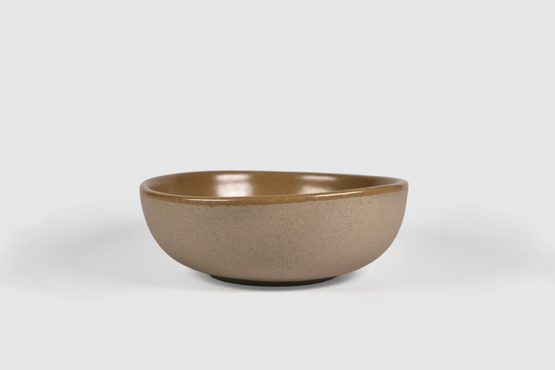 Bowl Sanka by Humo 1810 – black semi-matte stoneware, unglazed exterior, soft triangular form, 6.25 inch