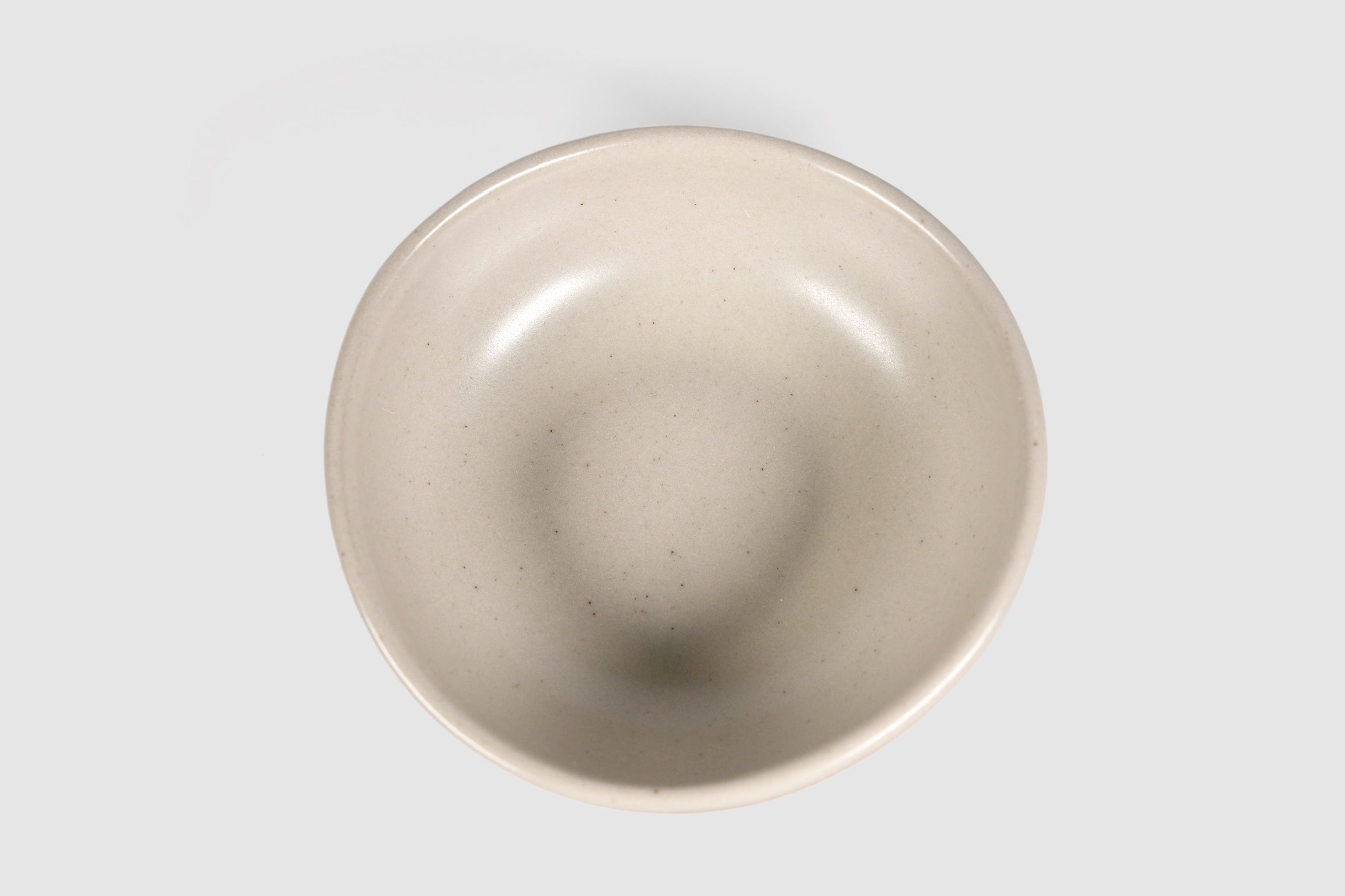 Bowl Sanka by Humo 1810 – black semi-matte stoneware, unglazed exterior, soft triangular form, 6.25 inch