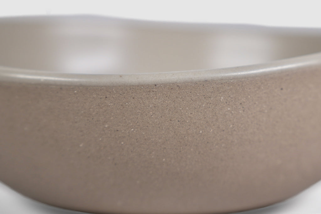 Bowl Sanka by Humo 1810 – black semi-matte stoneware, unglazed exterior, soft triangular form, 6.25 inch