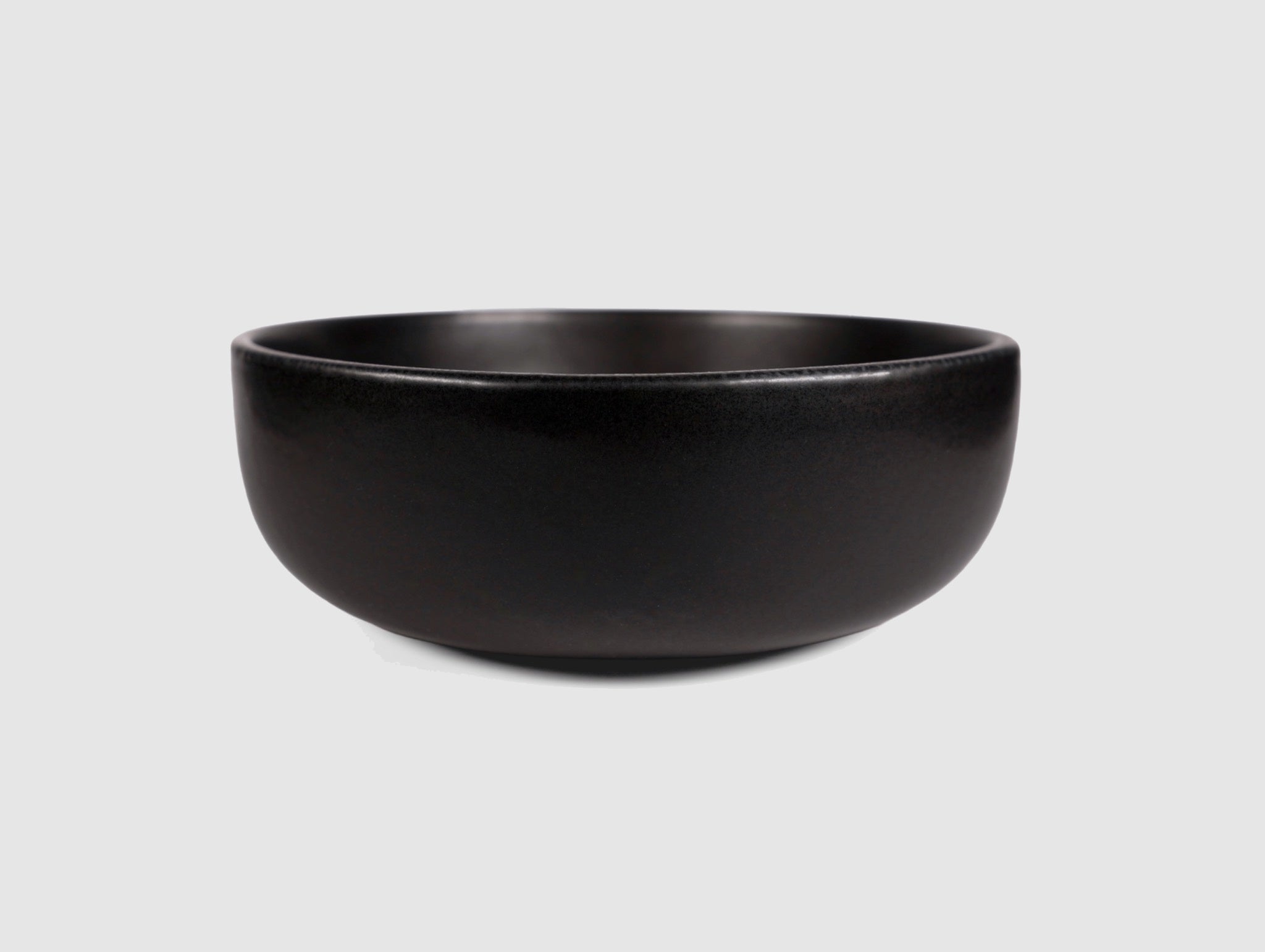 High Curved Bowl by Humo 1810 – deep stoneware, inward-curving walls, rolled matte rim, 8.25 inch