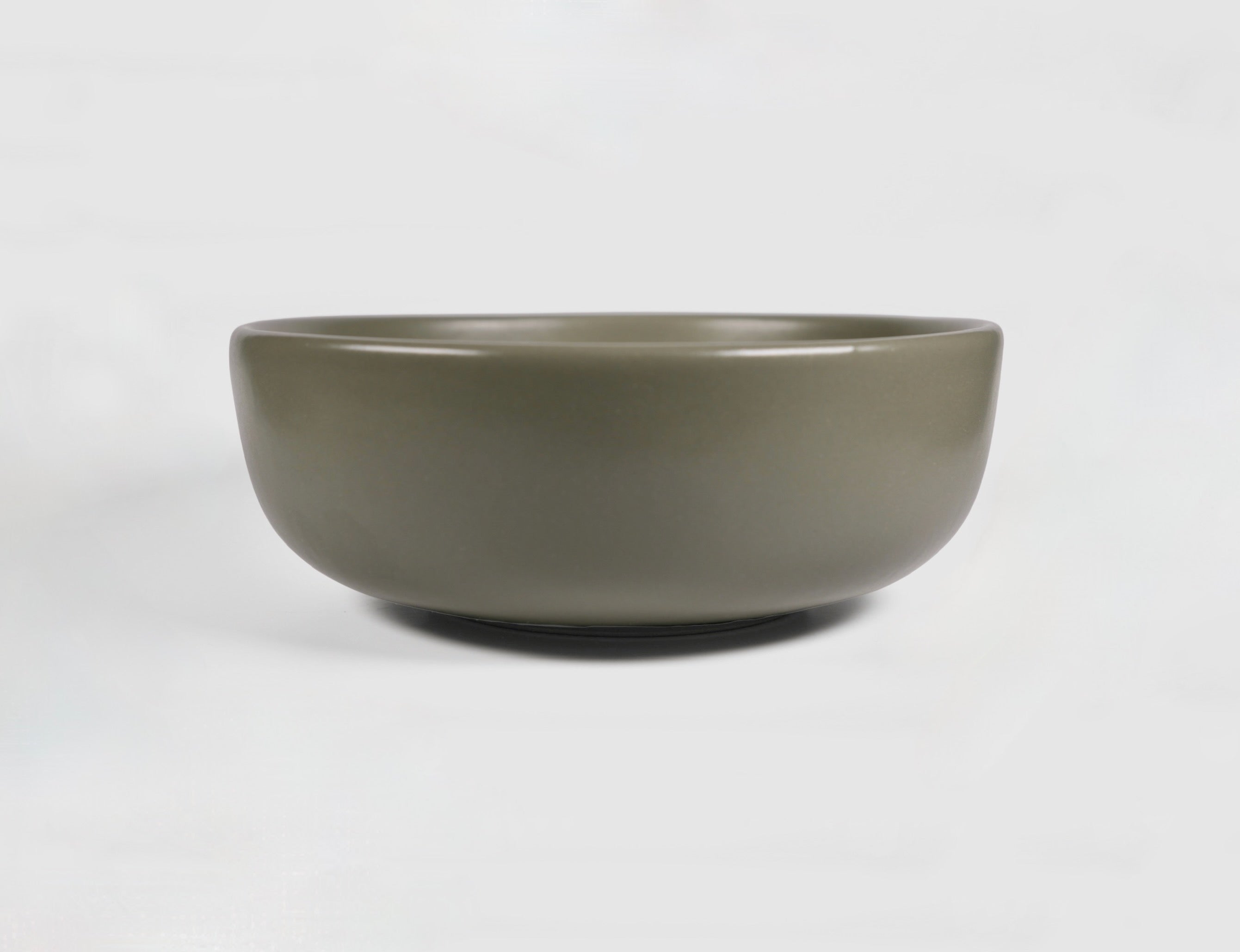 High Curved Bowl by Humo 1810 – deep stoneware, inward-curving walls, rolled matte rim, 8.25 inch