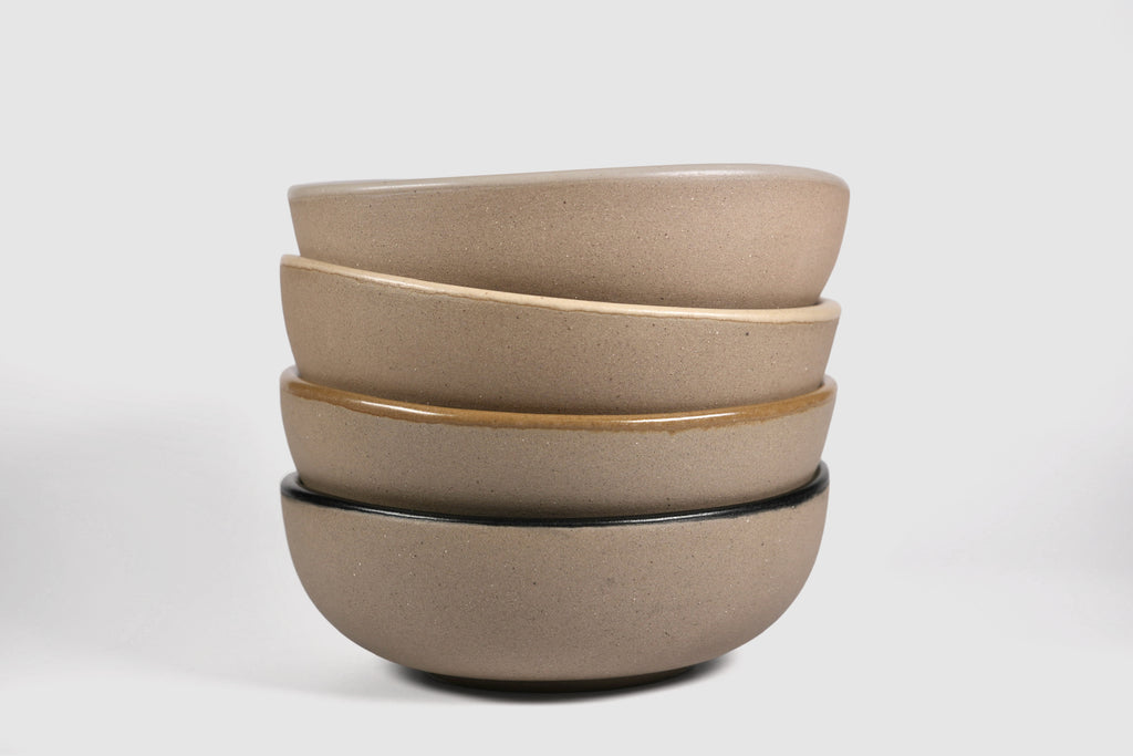 Bowl Sanka by Humo 1810 – black semi-matte stoneware, unglazed exterior, soft triangular form, 6.25 inch