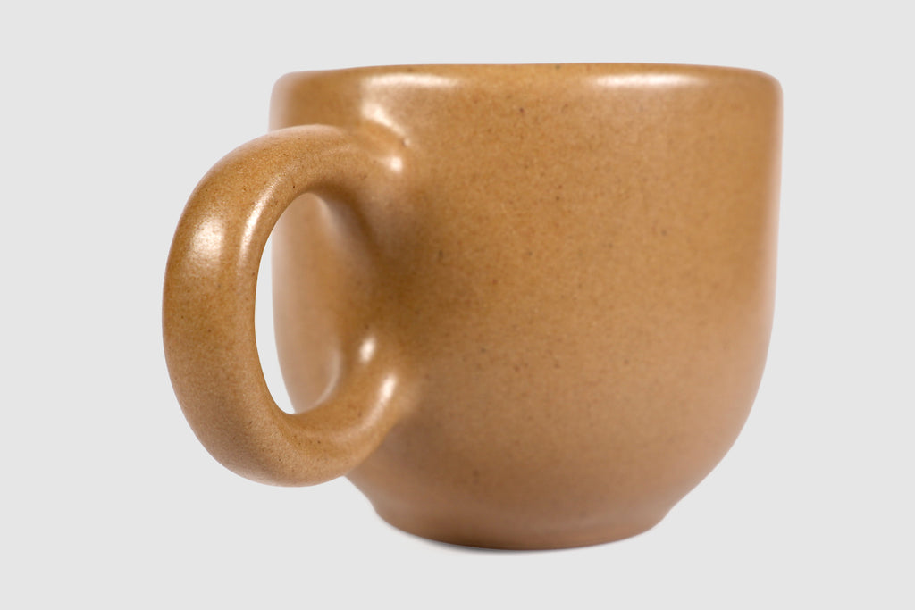 Rounded cappuccino mug with spherical body and circular ring handle in Pardo