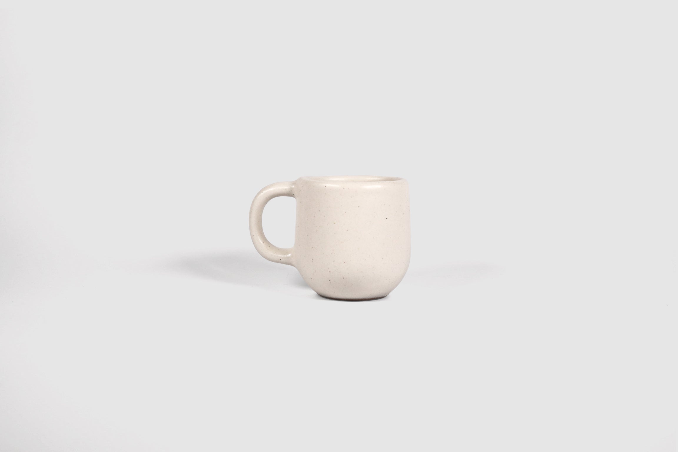 Small Pardo espresso mug with rounded belly and pulled loop handle