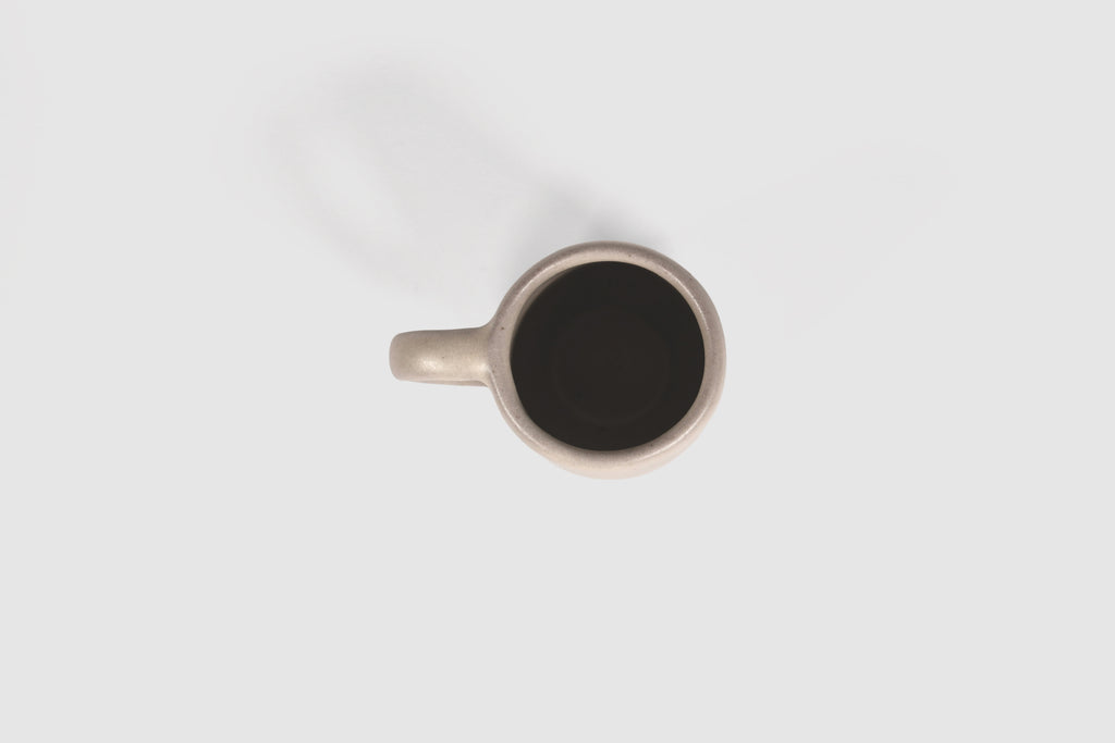 Small Pardo espresso mug with rounded belly and pulled loop handle