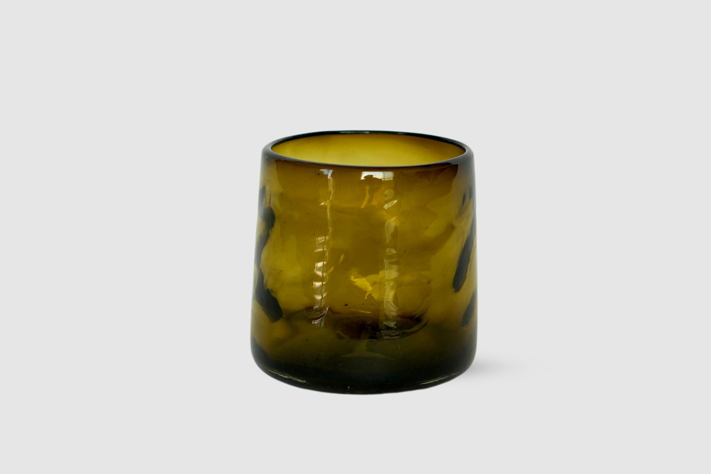 Olive green hand-blown short highball with organic silhouette on white