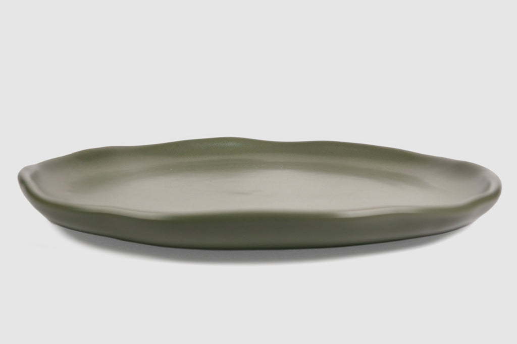 Dinner Plate Safin by Humo 1810 – olive green stoneware, gently undulating rim, 10.75 inch