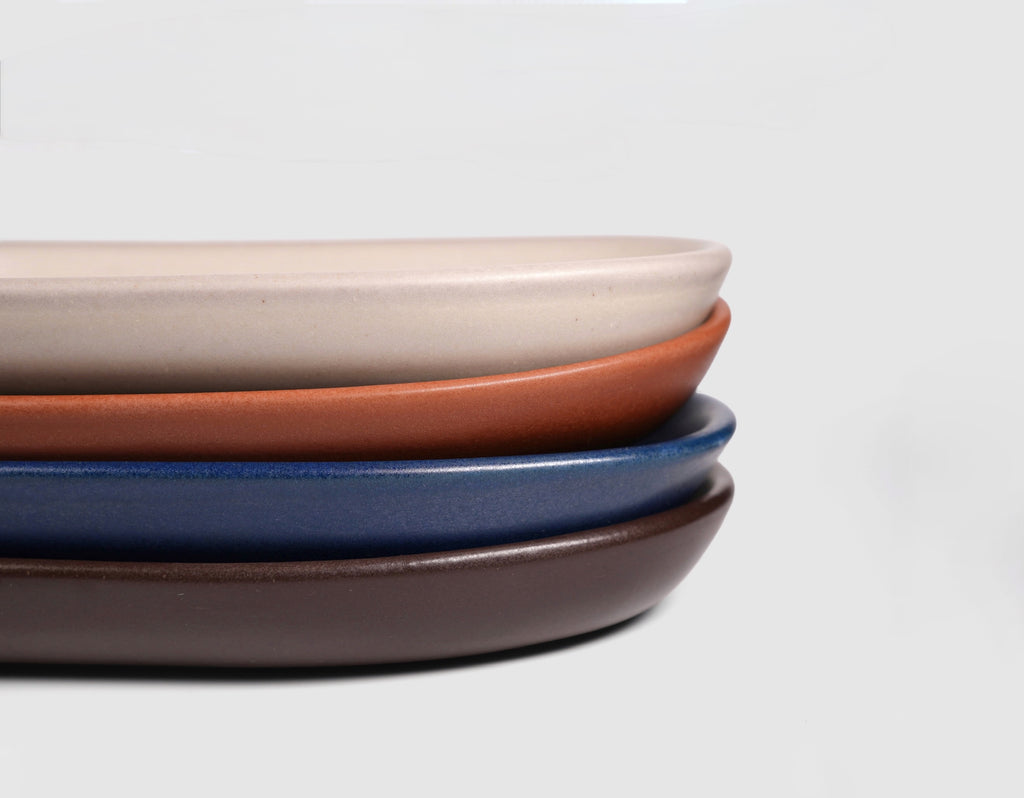 Small Baguette Tray by Humo 1810 – rojizo oval stoneware tray, raised rim, red-clay glaze, 10.25 inch