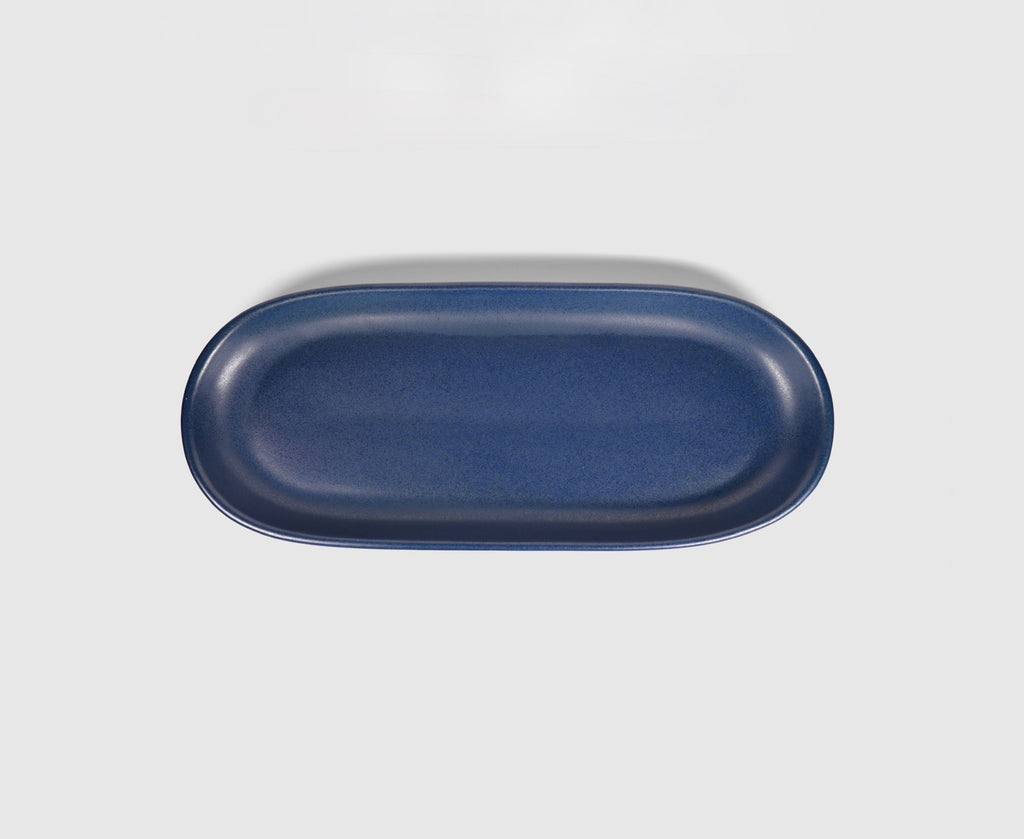 Small Baguette Tray by Humo 1810 – rojizo oval stoneware tray, raised rim, red-clay glaze, 10.25 inch