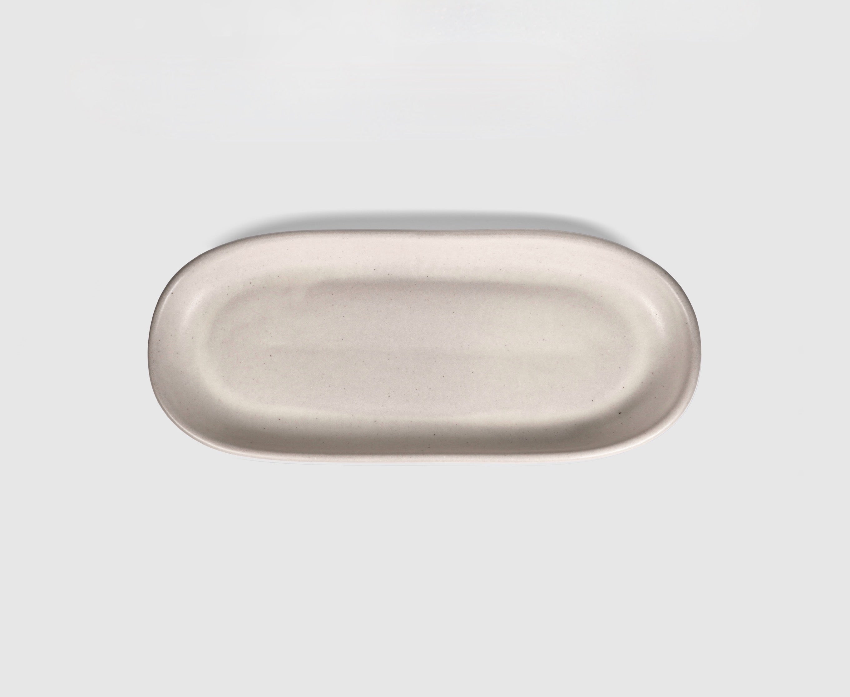 Small Baguette Tray by Humo 1810 – rojizo oval stoneware tray, raised rim, red-clay glaze, 10.25 inch