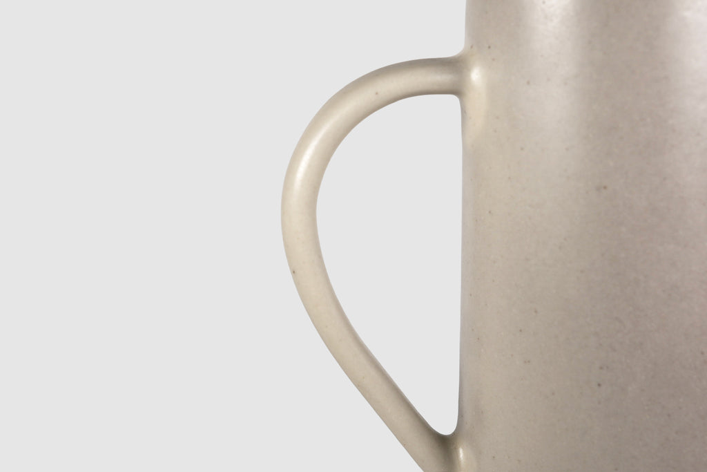 Tall Rojizo ceramic pitcher with tapered body, pouring lip and pulled handle