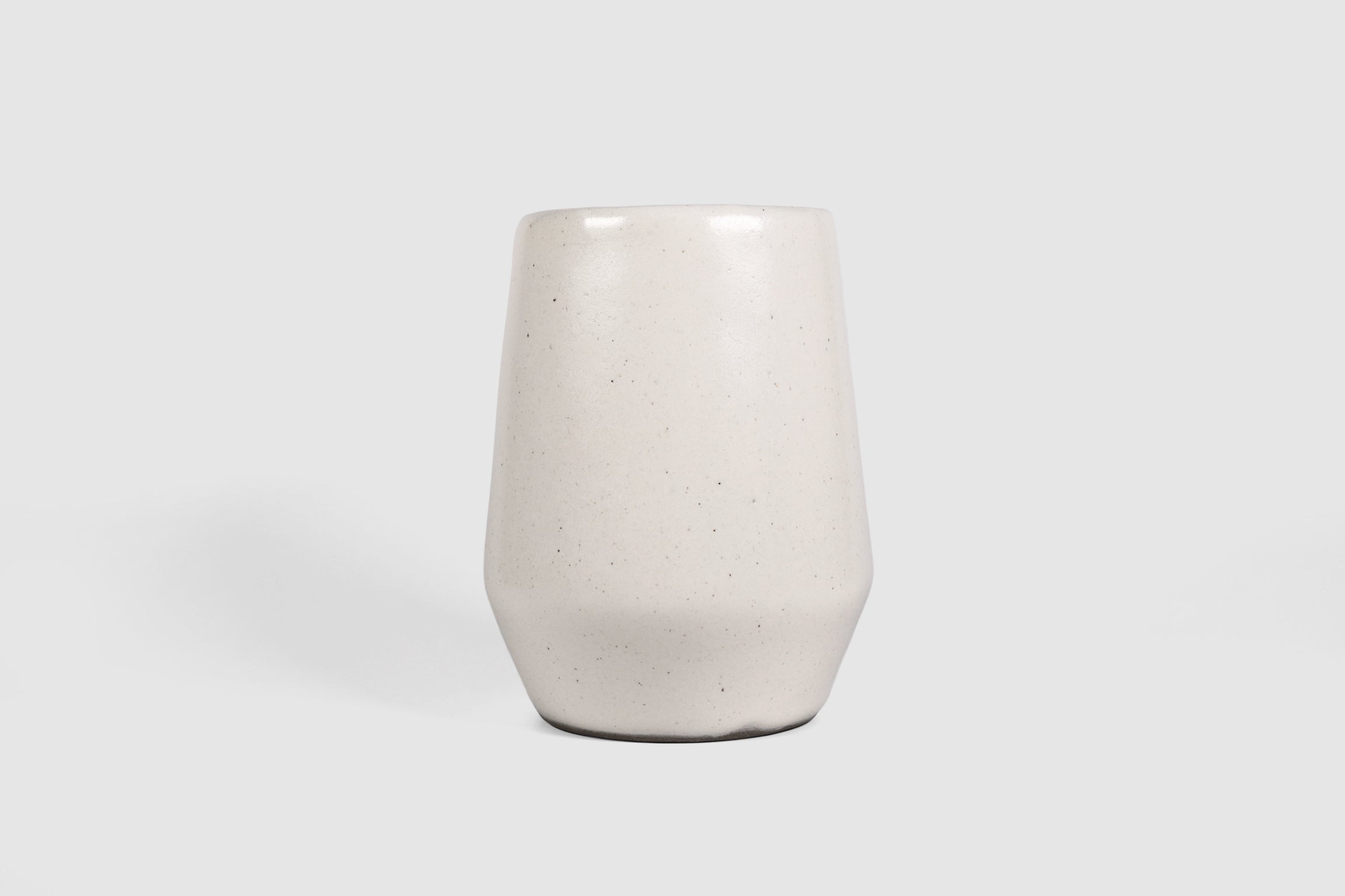 Tall stoneware tumbler with shouldered taper, matte finish.