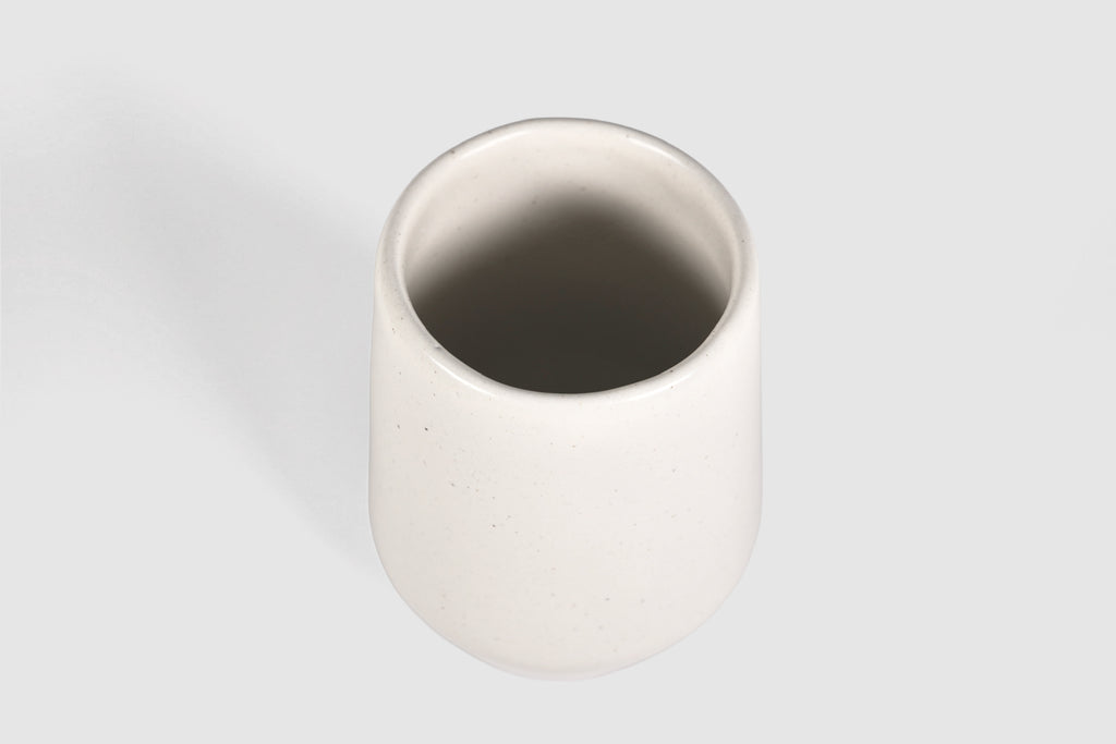 Tall stoneware tumbler with shouldered taper, matte finish.