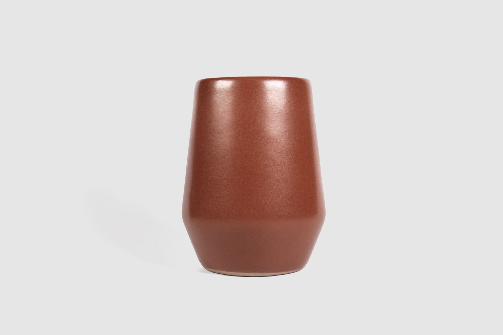 Tall stoneware tumbler with shouldered taper, matte finish.