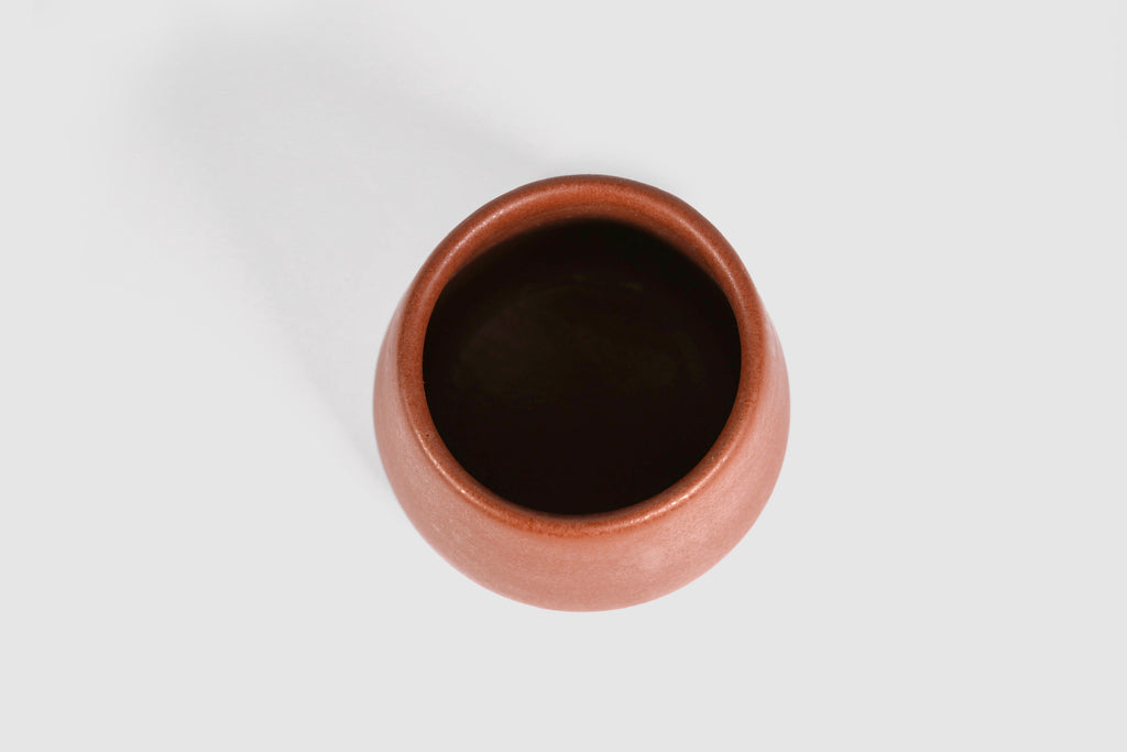Squat stoneware tumbler, low belly, softly rolled matte rim.
